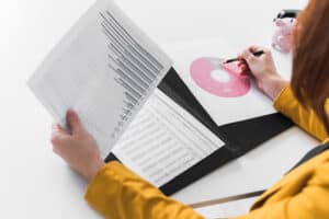 Woman studying report graphs