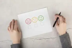 Scoreboard on paper with three different emotions