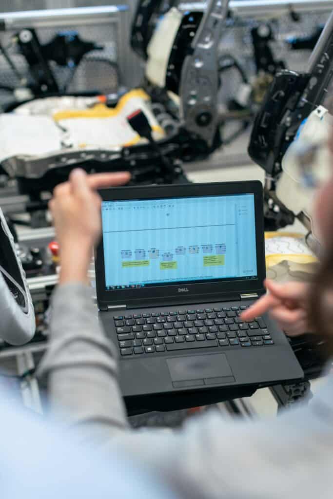 Engineer reviews data on her laptop
