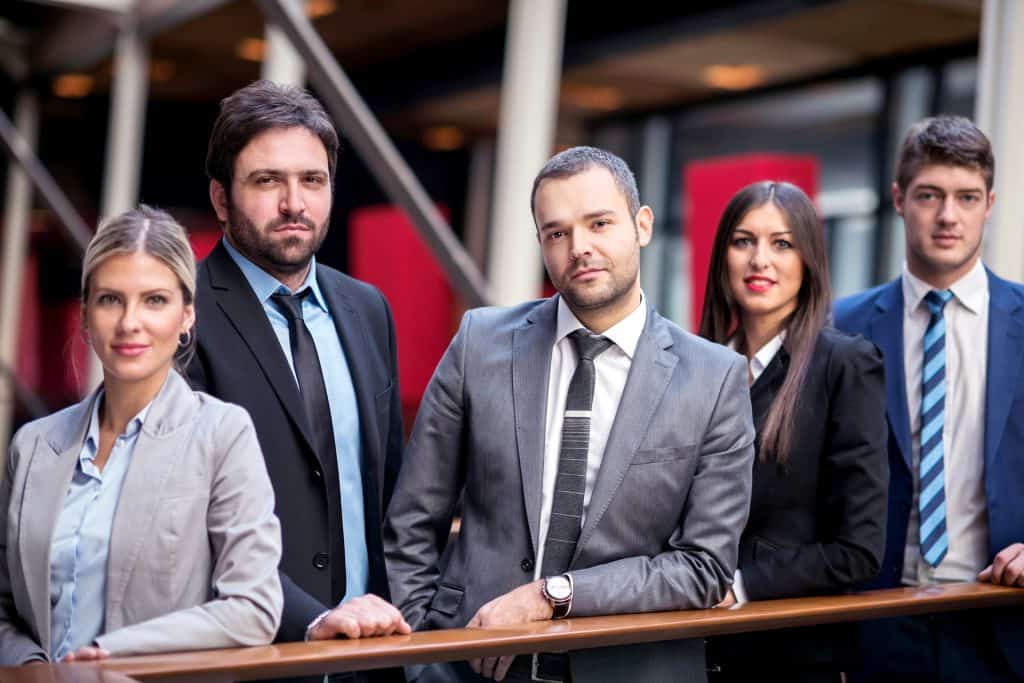 Young multi ethnic business people group standing